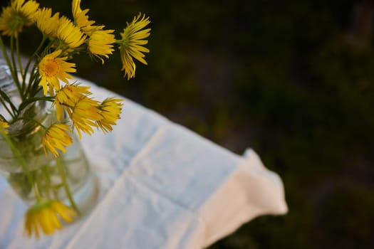 top view of a bouquet of yellow flowers standing on the street. High quality photo