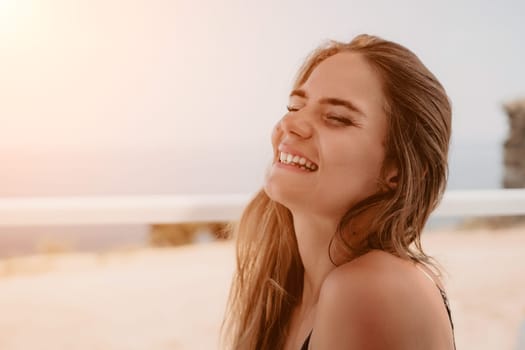 Happy woman portrait in cafe. Boho chic fashion style. Outdoor photo of young happy woman with long hair, sunny weather outdoors sitting in modern cafe