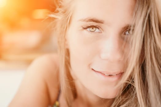 Happy woman portrait in cafe. Boho chic fashion style. Outdoor photo of young happy woman with long hair, sunny weather outdoors sitting in modern cafe