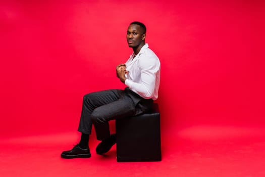 Happy african american young businessman in a formal suit. Smiling confident black guy