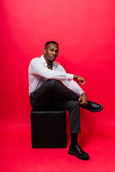 Happy african american young businessman in a formal suit. Smiling confident black guy