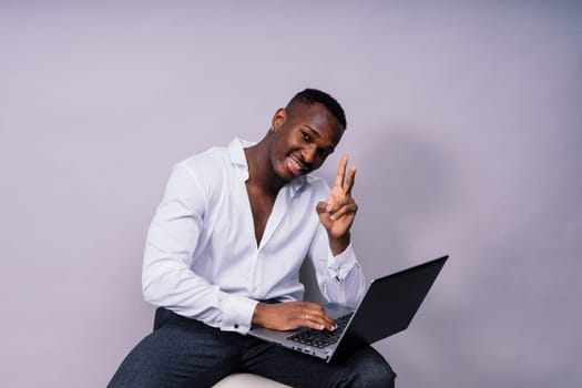 Happy african american young businessman in a formal suit. Smiling confident black guy