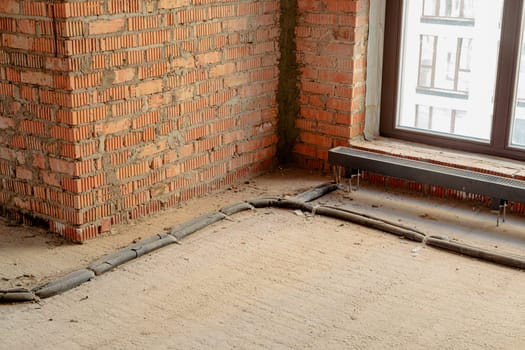 Repair and restoration of apartments. Red brick walls, concrete floors