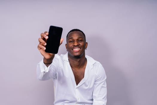 Happy african american young businessman in a formal suit. Smiling confident black guy