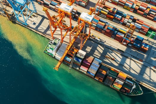 Aerial view of containers loading and unloading to the ship in the sea port. Logistic and transportation of goods. Crisis and shortage of containers in the world. September 2021, Georgia, USA