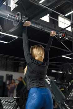 Barbell press, woman and exercise for fitness, workout and sports training in gym. power and energy.