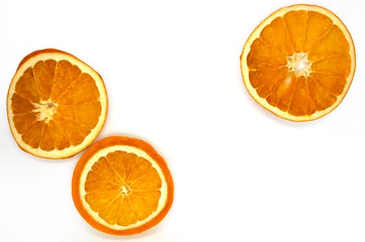 Dried orange slices, close-up. Slices of dried orange on a white background.