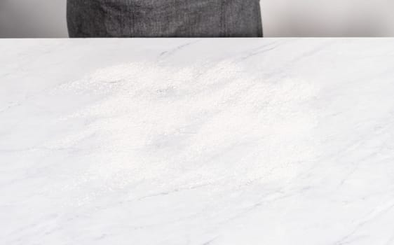 Kitchen counter covered with white flour for rolling the dough.