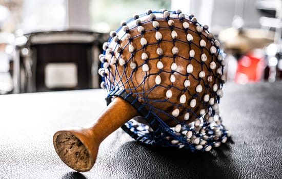 Maraca for hispanic music on table in recording studio. Traditional shaking musical instrument for ethnic perfomance