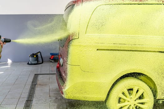wash cars with green active foam in the garage. High quality photo