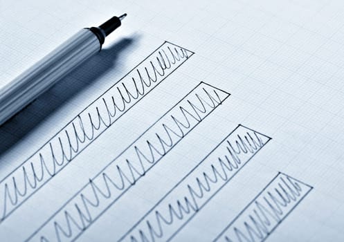 close up of a business finance graph, papers and pencil