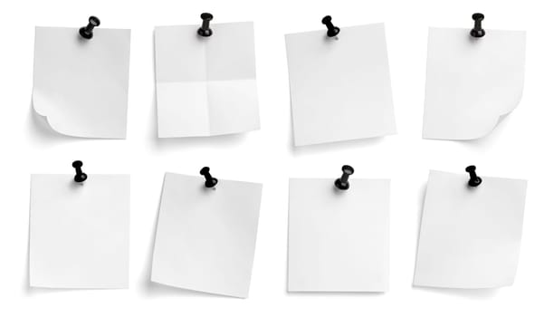 collection of various note paper with a push pin on white background