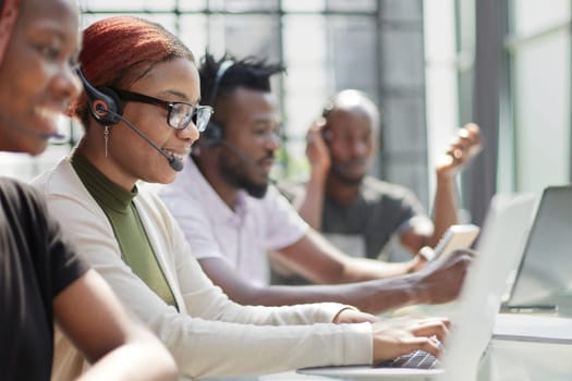 Call Center Operator With Colleagues At Workplace