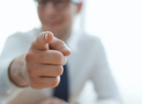 businessman pointing his finger to you at office