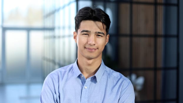 portrait of asian businessman in blue shirt