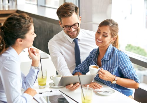 Friends having fun in a restaurant or cafeteria coffee shop. Young businesspeople during a break