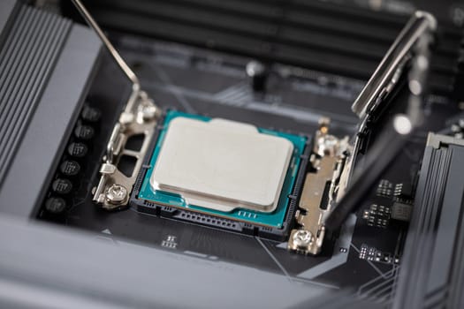 Gently and carefully connecting a new computer part. Purchasing and replacing computer parts to increase the performance of the device. Connecting the new processor to the computer