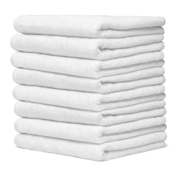 close up of a stack of white towels bathroom on white background