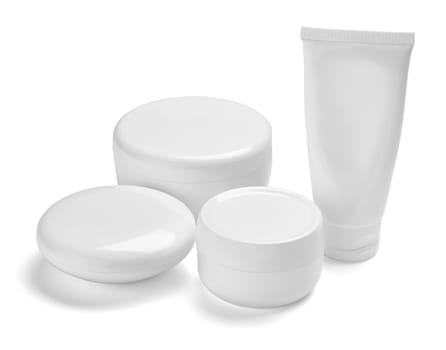 close up of a white beauty cream container and tube on white background