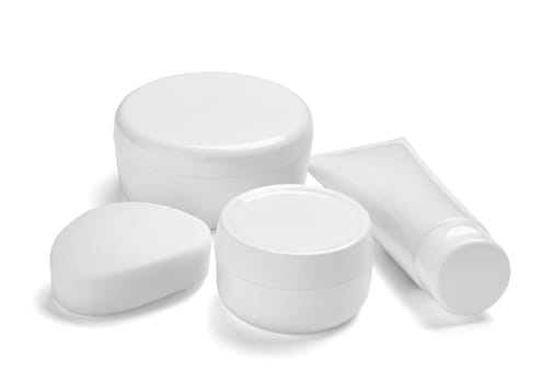 close up of a white beauty cream container and tube on white background