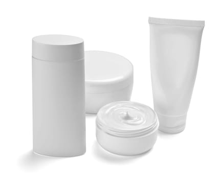close up of a white beauty cream container and tube on white background
