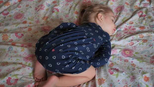 The little girl sleeps funny on the crusts