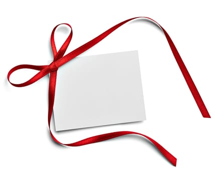 close up of a note card with red ribbon bow on white background