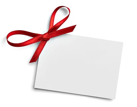 close up of a note card with red ribbon bow on white background