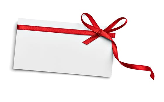 close up of a note card with red ribbon bow on white background