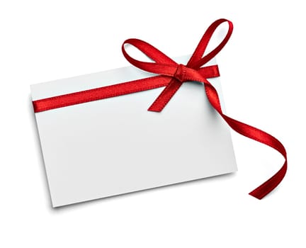 close up of a note card with red ribbon bow on white background