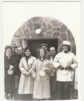 THE CZECHOSLOVAK REPUBLIC - CIRCA 1980s: Vintage photo shows group of people poses outdoors in winter time. Retro black and white photography. Circa 1980s.