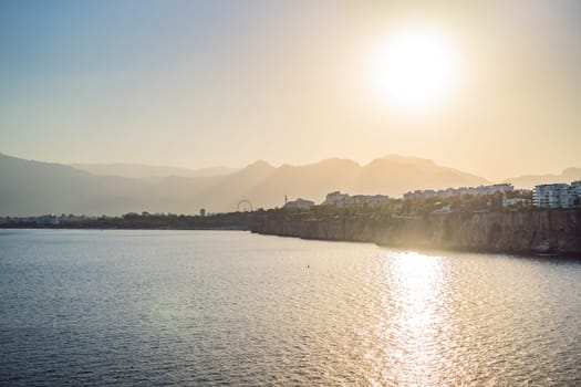 Old town Kaleici in Antalya. Panoramic view of Antalya Old Town port, Taurus mountains and Mediterrranean Sea, Turkey.