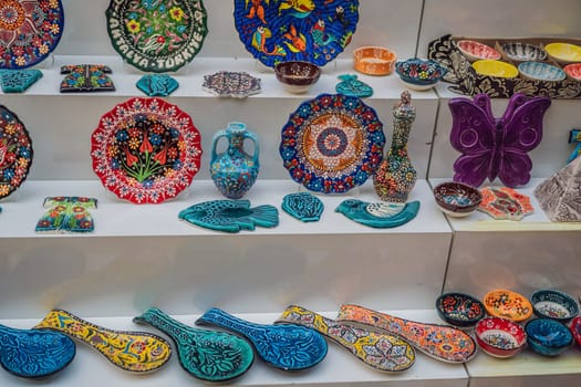 Collection of turkish ceramics on sale at the Grand Bazaar in Istanbul, Turkey. Turkish colorful ornamental ceramic souvenir plates.