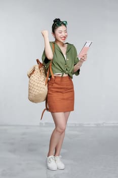 Portrait beautiful young asian woman with backpack travel bag with passport and boarding pass ticket 