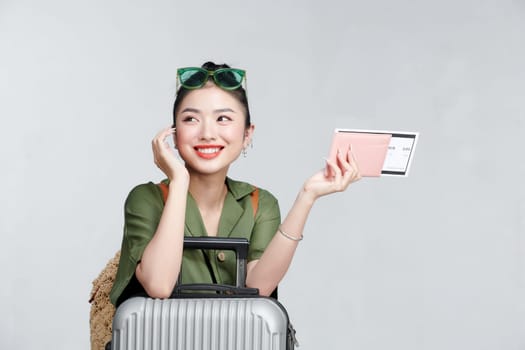 Beautiful travel woman with passport isolated on white background