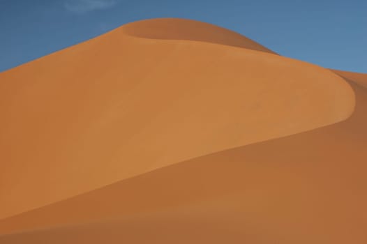 The orange dunes of the libyan Sahara desert