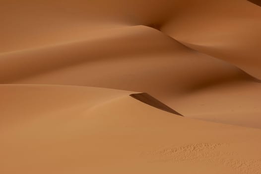 The orange dunes of the libyan Sahara desert