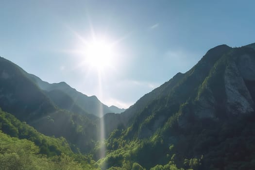 Beautiful sunrise over the green mountains in morning light with fluffy clouds on a bright blue sky. Nature freshness concept.