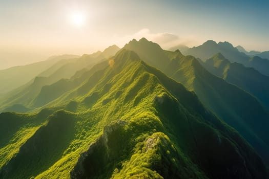 Beautiful sunrise over the green mountains in morning light with fluffy clouds on a bright blue sky. Nature freshness concept.