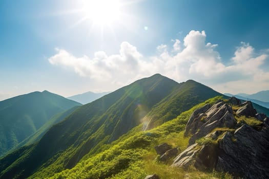 Beautiful sunrise over the green mountains in morning light with fluffy clouds on a bright blue sky. Nature freshness concept.