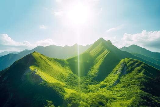 Beautiful sunrise over the green mountains in morning light with fluffy clouds on a bright blue sky. Nature freshness concept.