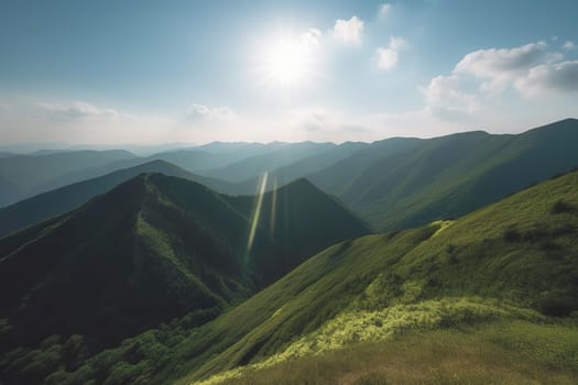 Beautiful sunrise over the green mountains in morning light with fluffy clouds on a bright blue sky. Nature freshness concept.