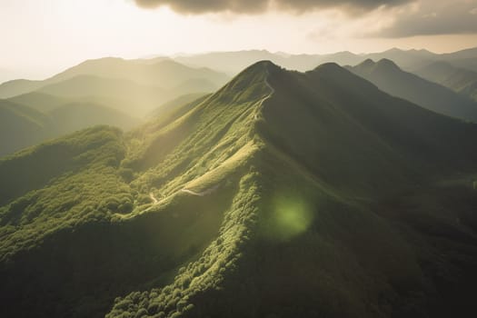 Beautiful sunrise over the green mountains in morning light with fluffy clouds on a bright blue sky. Nature freshness concept.