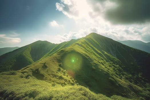 Beautiful sunrise over the green mountains in morning light with fluffy clouds on a bright blue sky. Nature freshness concept.