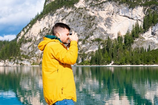 Travel photographer taking a picture of the amazing Dolomites Alps, Italy.