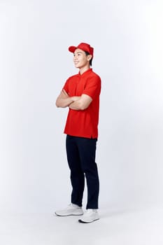 Young asian man in uniform red and cap standing arms crossed with confident isolated on white background