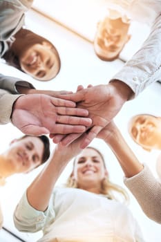 Business people, hands stack and circle with smile, team building and support for goals in workplace. Men, women and teamwork with solidarity for happiness, motivation and trust with diversity at job.