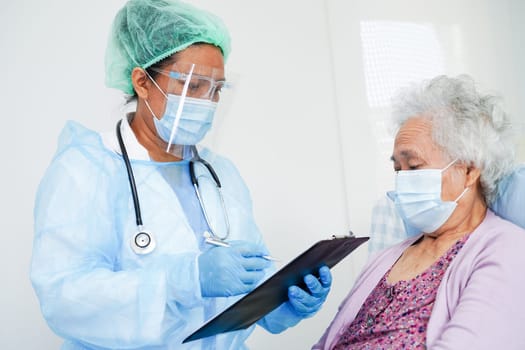 Doctor check Asian elder senior woman patient wearing a mask for protect covid coronavirus.