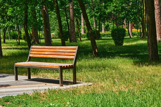 a long seat for several people, typically made of wood or stone.