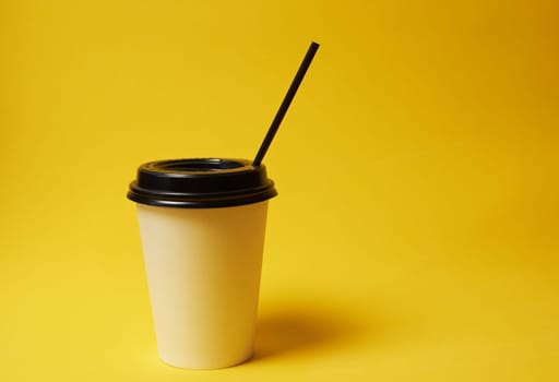 Paper Coffee Container with Black Lid on Yellow Background White Coffee Paper Cup with Black Lid on Yellow Background Takeaway Coffee